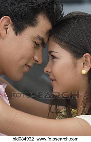 Hispanic couple hugging View Large Photo Image Stock Image - Hispanic couple hugging. Fotosearch