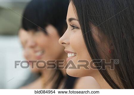 Picture - Hispanic friends hanging out together. Fotosearch