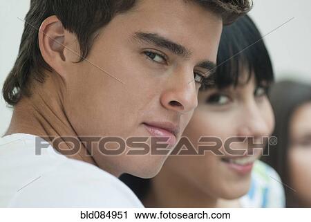 Stock Image - Hispanic friends hanging out together. Fotosearch