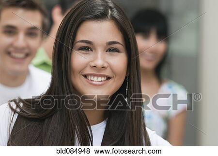 Stock Photo - Hispanic friends hanging out together. Fotosearch