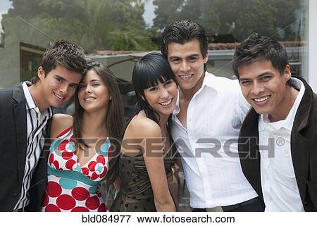 Stock Photo - Hispanic friends hanging out together. Fotosearch