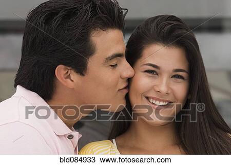 Hispanic man kissing girlfriend View Large Photo Image Stock Image - Hispanic man kissing girlfriend. Fotosearch
