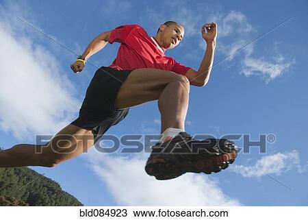Stock Image - Hispanic man running. Fotosearch