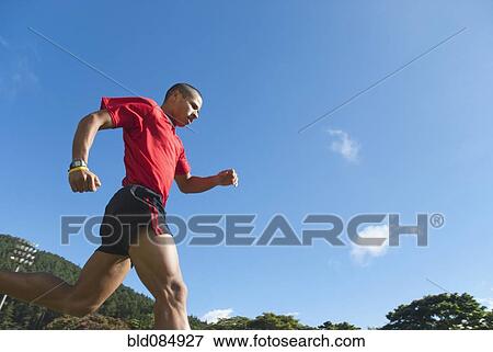 Stock Photo - Hispanic man running. Fotosearch