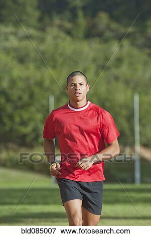 Stock Photo - Hispanic man running. Fotosearch