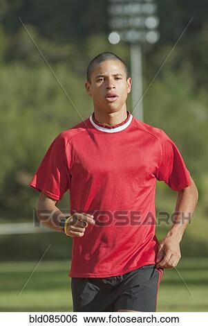 Stock Photograph - Hispanic man running. Fotosearch