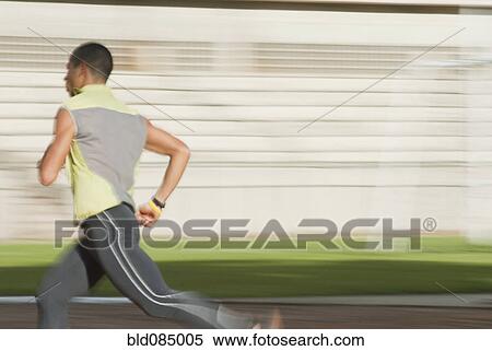 Stock Photography - Hispanic man running. Fotosearch