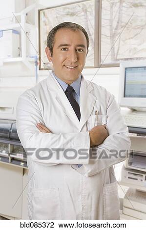 Hispanic technician standing in office View Large Photo Image Stock Image - Hispanic technician standing in office. Fotosearch