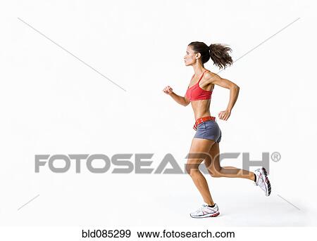 Hispanic woman in sportswear running View Large Photo Image Stock Photo - Hispanic woman in sportswear running. Fotosearch