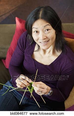 Stock Photo - Japanese woman knitting. Fotosearch
