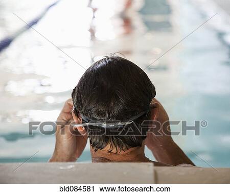 Man swimming in swimming pool View Large Photo Image Stock Image - Man swimming in swimming pool. Fotosearch