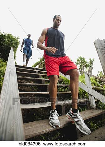 Men running down stairs for exercise View Large Photo Image Stock Photograph - Men running down stairs for exercise. Fotosearch