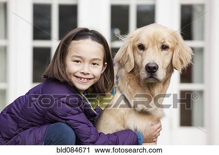 Mixed race girl hugging Golden retriever View Large Photo Image Stock Image - Mixed race girl hugging Golden retriever. Fotosearch