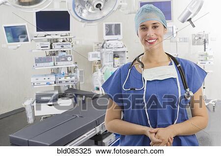 Stock Photography - Mixed race surgeon in operating room. Fotosearch