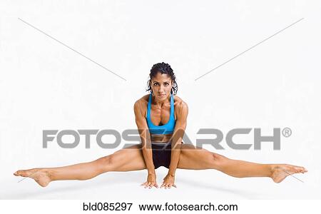 Mixed race woman gymnast balancing on hands View Large Photo Image Stock Photo - Mixed race woman gymnast balancing on hands. Fotosearch
