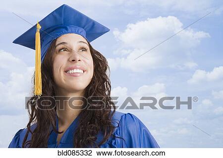 Mixed race woman wearing graduation cap and gown View Large Photo Image Stock Image - Mixed race woman wearing graduation cap and gown. Fotosearch