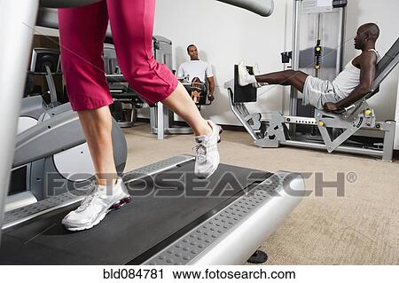 People exercising in health club View Large Photo Image Stock Image - People exercising in health club. Fotosearch