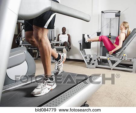 People exercising in health club View Large Photo Image Stock Photo - People exercising in health club. Fotosearch