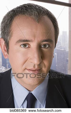 Serious Hispanic businessman View Large Photo Image Stock Photo - Serious Hispanic businessman. Fotosearch