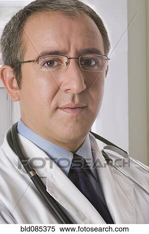 Stock Photography - Serious Hispanic doctor. Fotosearch