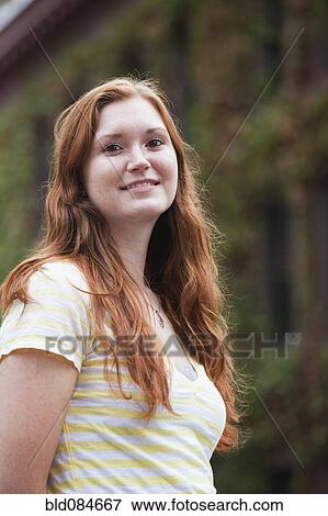 Stock Photo - Smiling Caucasian teenage girl. Fotosearch