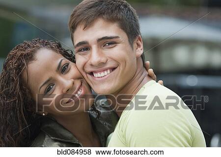 Smiling couple hugging View Large Photo Image Stock Photo - Smiling couple hugging. Fotosearch
