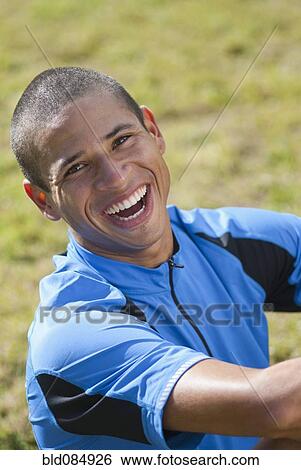 Smiling Hispanic athlete View Large Photo Image Stock Photograph - Smiling Hispanic athlete. Fotosearch