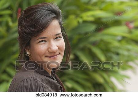 Smiling Hispanic teenage girl View Large Photo Image Stock Photo - Smiling Hispanic teenage girl. Fotosearch