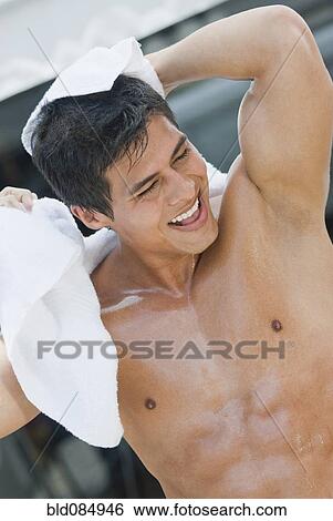 Wet Hispanic man drying off View Large Photo Image Stock Photograph - Wet Hispanic man drying off. Fotosearch