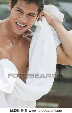Wet Hispanic man drying off View Large Photo Image Stock Photography - Wet Hispanic man drying off. Fotosearch
