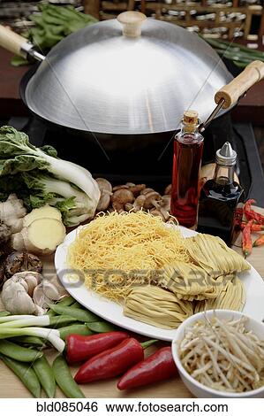 Stock Photograph - Wok, noodles and vegetables. Fotosearch
