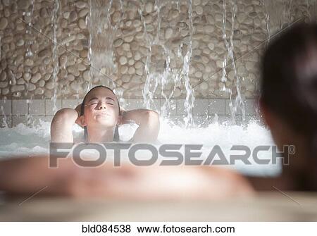 Stock Photo - Woman enjoying hydrotherapy treatment. Fotosearch