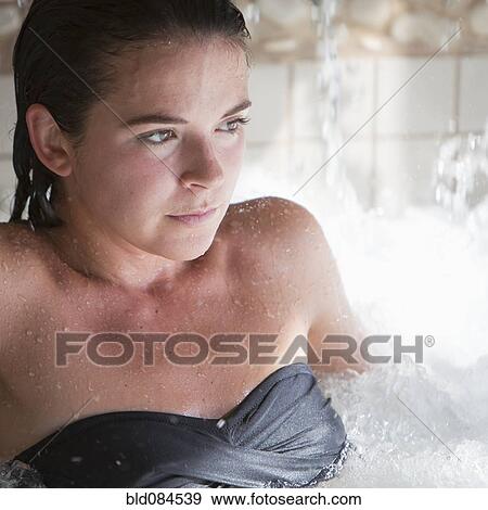 Stock Photo - Woman enjoying hydrotherapy treatment. Fotosearch