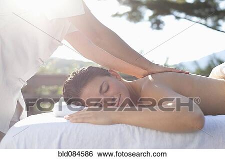 Stock Photograph - Woman having a massage. Fotosearch