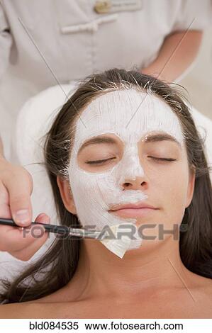 Stock Photography - Woman having facial spa treatment. Fotosearch