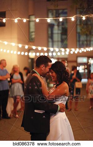 Bride and groom dancing at reception View Large Photo Image Stock Photo - Bride and groom dancing at reception. Fotosearch
