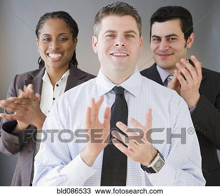 Stock Image - Business people clapping. Fotosearch