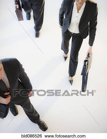 Stock Photograph - Business people walking together. Fotosearch