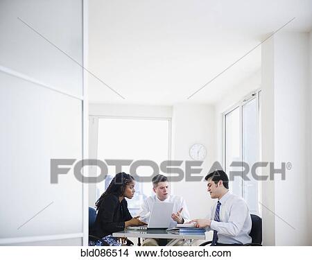 Picture - Business people working together in office. Fotosearch