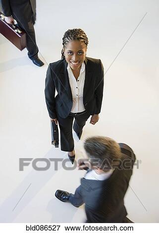 Stock Photo - Busy business people walking. Fotosearch