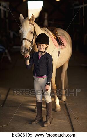 Caucasian girl standing with horse View Large Photo Image Stock Photography - Caucasian girl standing with horse. Fotosearch