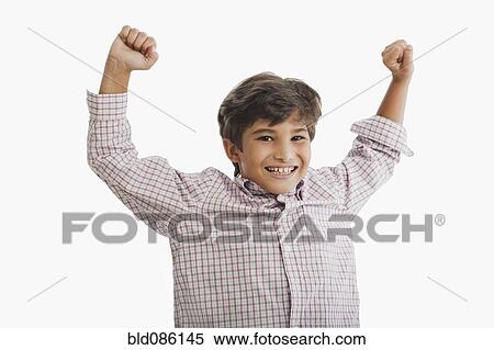 Stock Photography - Cheering Hispanic boy. Fotosearch