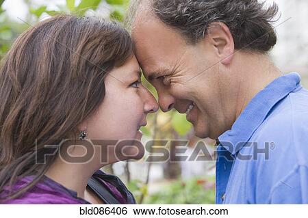 Stock Photograph - Chilean couple looking at one another. Fotosearch
