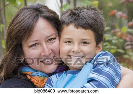 Chilean mother hugging son View Large Photo Image Stock Photo - Chilean mother hugging son. Fotosearch