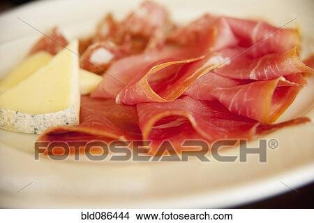 Picture - Close up of cheese and prosciutto. Fotosearch