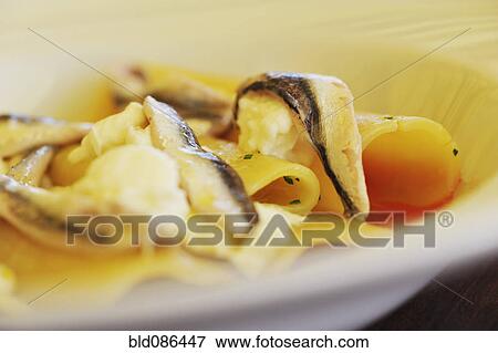 Stock Photo - Close up of fish and pasta dish. Fotosearch