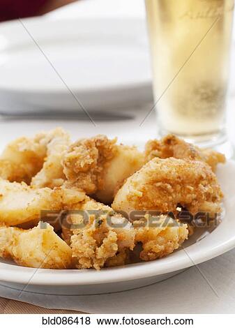 Stock Photo - Close up of fried Portuguese sardines. Fotosearch