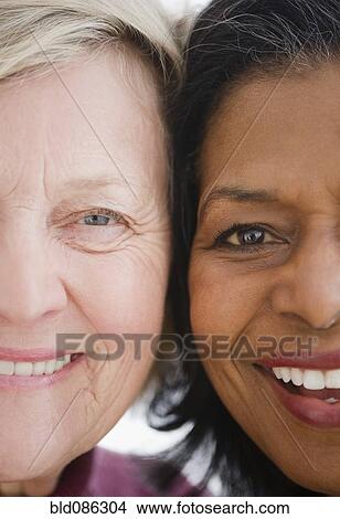 Close up of friends smiling View Large Photo Image Picture - Close up of friends smiling. Fotosearch