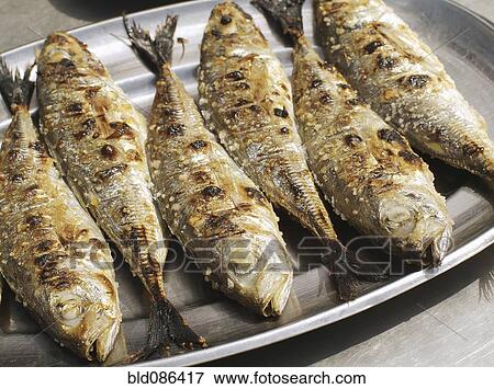 Stock Photo - Close up of grilled Portuguese sardines. Fotosearch