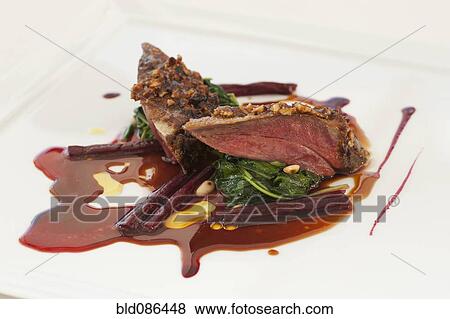 Stock Photo - Close up of pigeon entree. Fotosearch